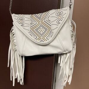 Chinese Laundry white fringe and accent handbag.